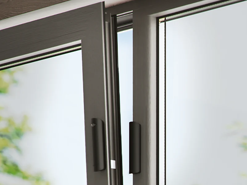 Ajax DoorProtect opening detectors fitted to a sliding door frame
