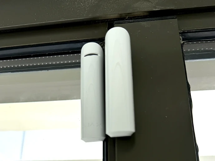 Ajax DoorProtect opening detector installed on a sliding door frame in a Dubai villa